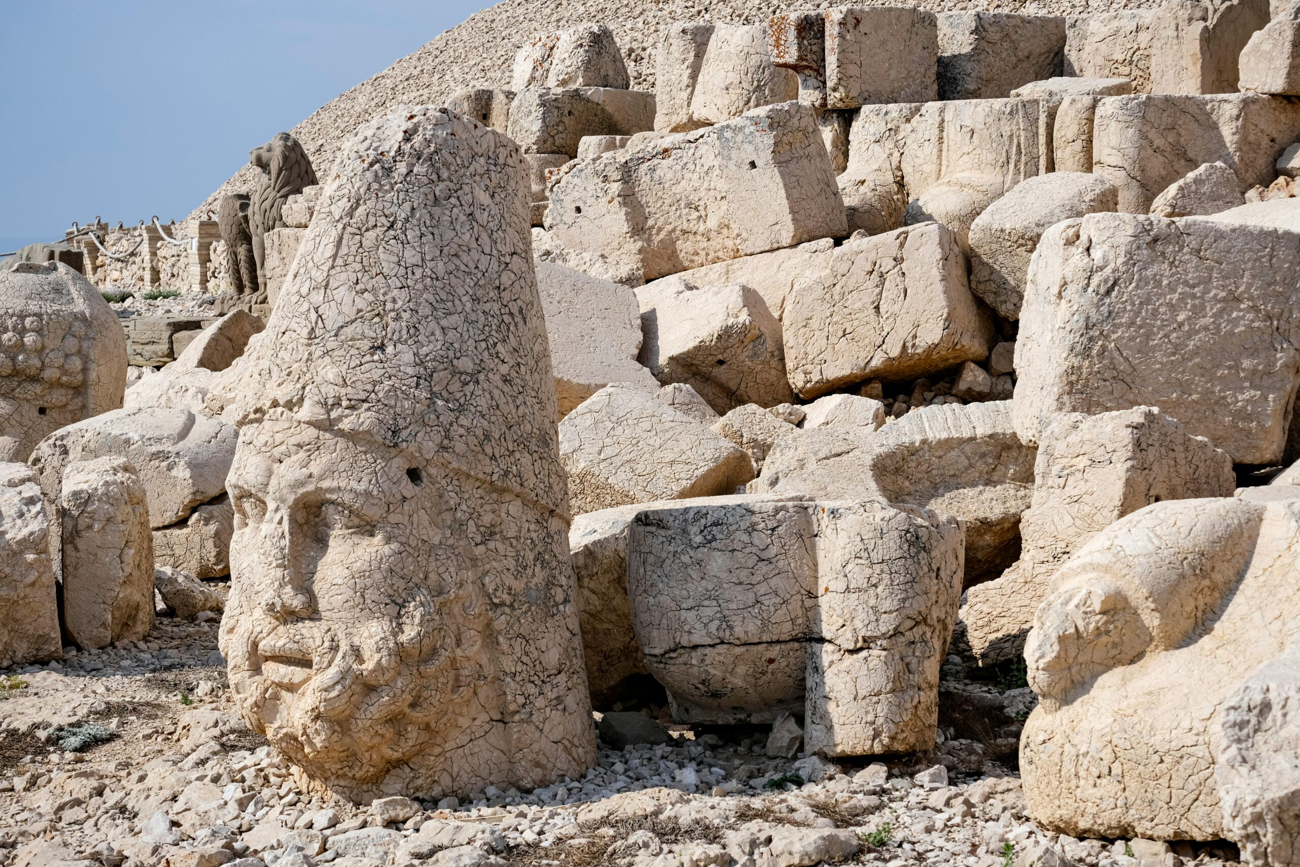 Ancient stone heads at Mount Nemrut, capturing historical architecture and natural setting.